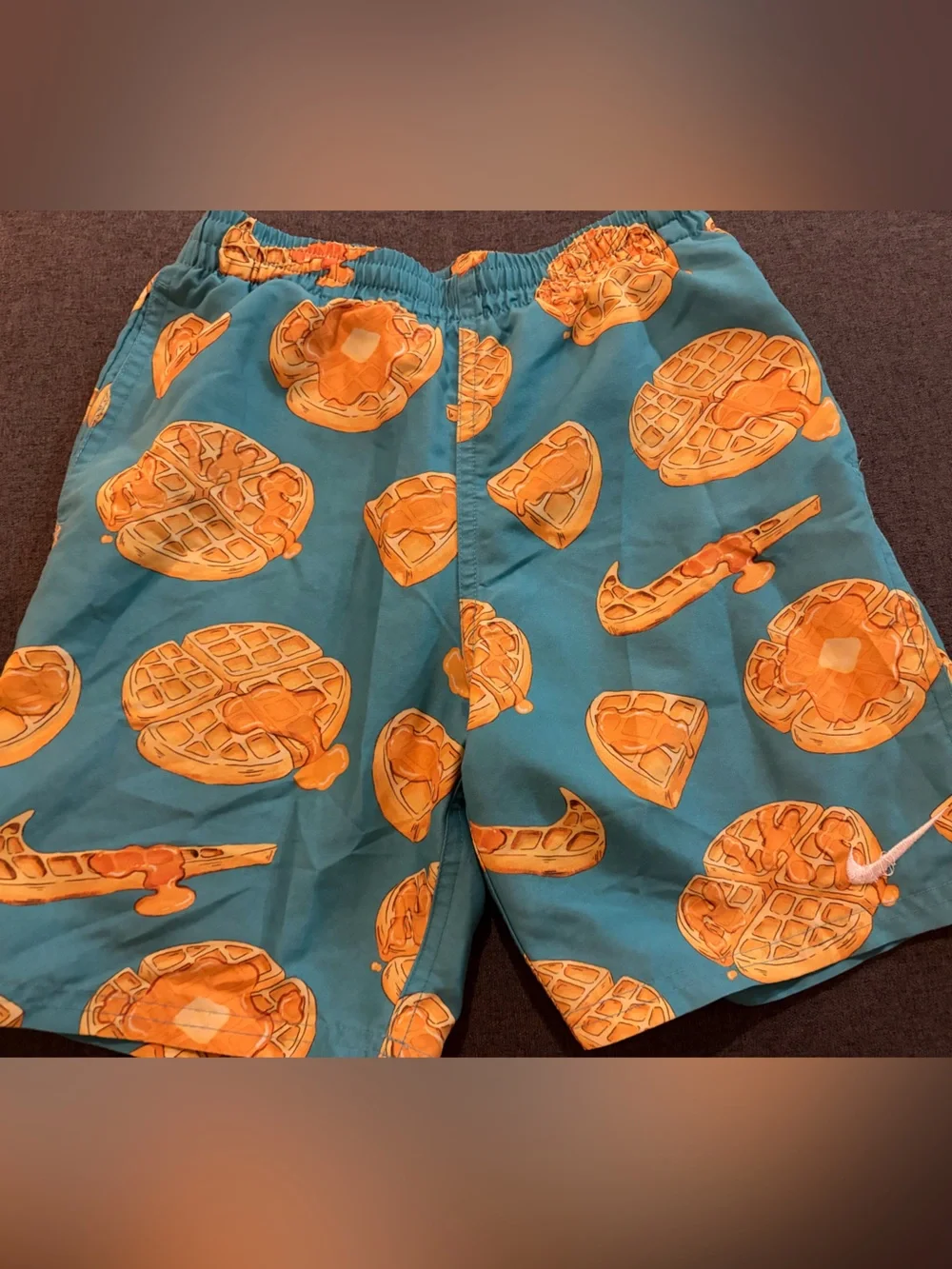 Nike Kids Teal Swim Trunks with Orange Waffle Print